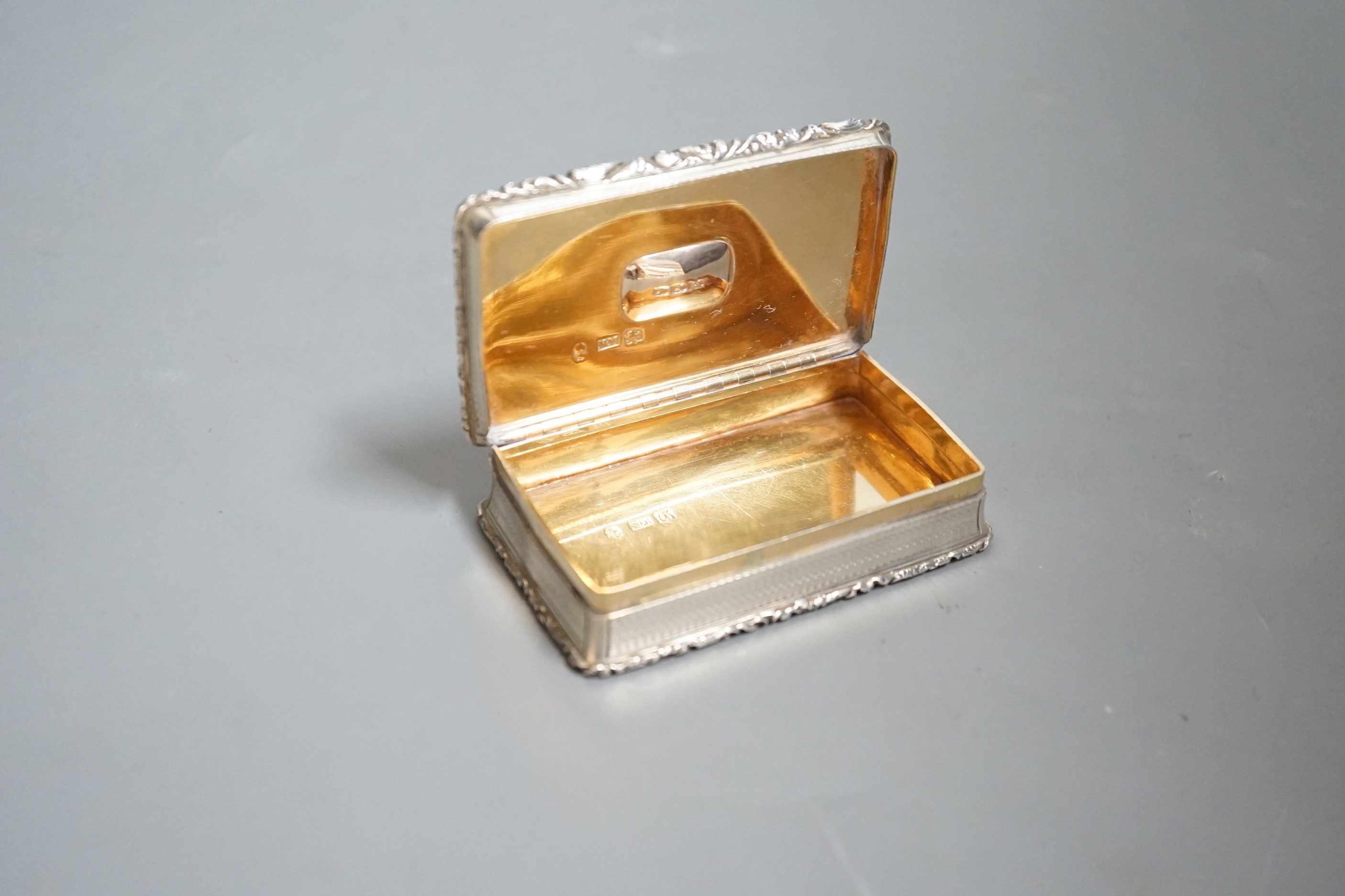 A William IV silver and citrine mounted rectangular snuff box, by Nathaniel Mills, Birmingham, 1830, with engraved inscription, 83mm.